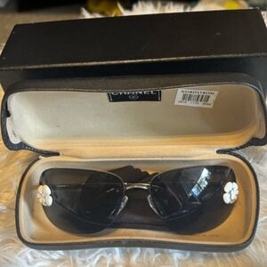 CHANEL Black Sunglasses with White Floral Accents